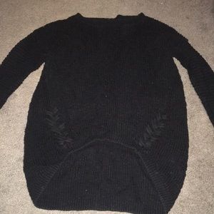 Three quarter sleeve black sweater.